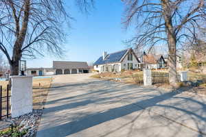 View of front of house featuring a garage and solar panels