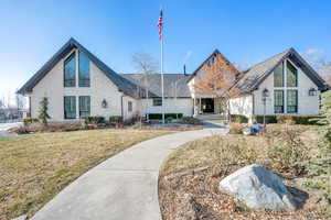 View of front of property with a front yard