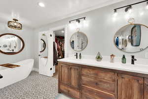 Bathroom with vanity and a bathtub