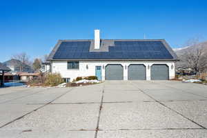 View of side of home with solar panels