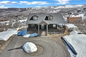 View of front of house with a mountain view and covered porch