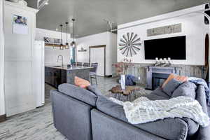 Living room with sink and light hardwood / wood-style floors