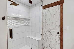 Bathroom featuring walk in shower