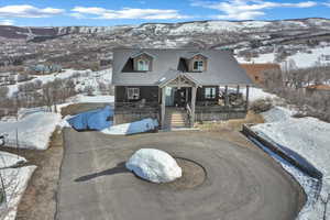 View of front facade featuring a porch and a mountain view