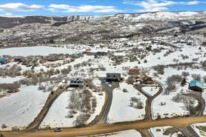 Snowy aerial view featuring a mountain view