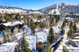 Snowy aerial view featuring a mountain view