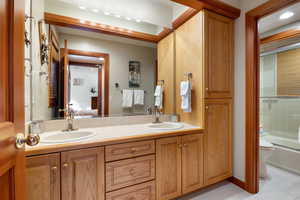 Full bathroom featuring bathing tub / shower combination, vanity, and toilet