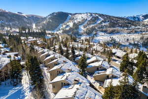 Snowy aerial view featuring a mountain view