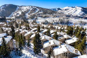 Snowy aerial view featuring a mountain view