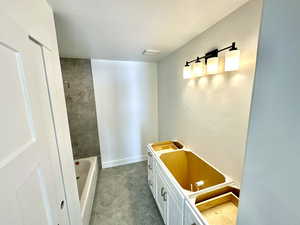 Second floor main bathroom featuring a tub/shower combo.