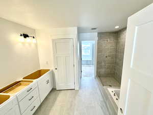 Owner's bathroom featuring double sink vanity and independent shower and bath.