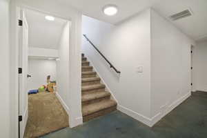 Stairway with concrete flooring