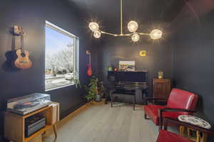 Living area with hardwood / wood-style floors