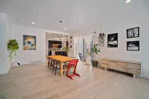 Dining space with light wood-type flooring