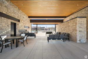 View of patio with an outdoor living space