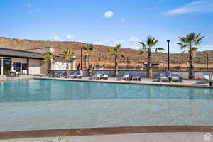 View of pool featuring a mountain view and a patio