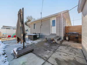 Rear view of property with a patio