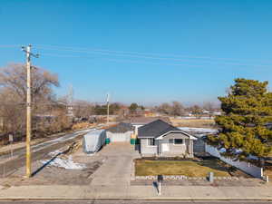 View of front of house featuring a garage and a front yard