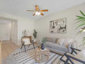 Living room with light tile patterned floors and ceiling fan