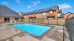 View of swimming pool with a patio