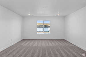 Unfurnished room with carpet flooring