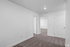 Empty room with carpet flooring