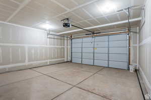 Garage featuring a garage door opener