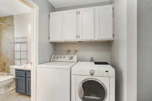 Washroom featuring washer and dryer