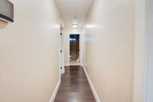 Hall featuring dark hardwood / wood-style floors