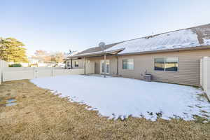 Rear view of house with central AC