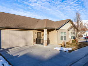 View of front of house featuring a mountain view and a garage