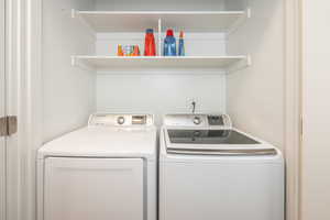 Laundry area with washer and clothes dryer