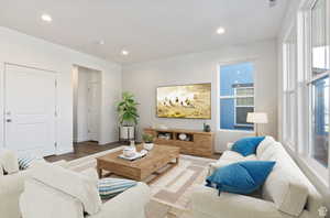 Living room with hardwood / wood-style flooring