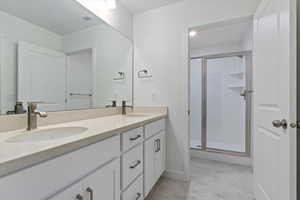 Bathroom with walk in shower and vanity