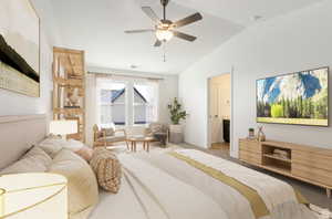 Bedroom with lofted ceiling, carpet flooring, and ceiling fan