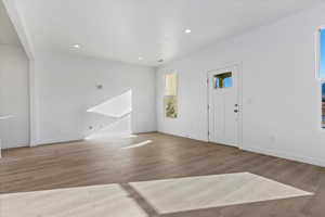 Foyer with light hardwood / wood-style floors