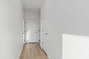 Hallway featuring light hardwood / wood-style floors