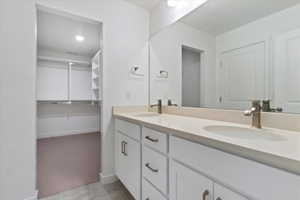 Bathroom featuring vanity and tile patterned flooring