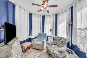 Sitting room with ceiling fan