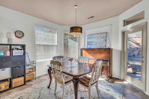 Dining area with an inviting chandelier