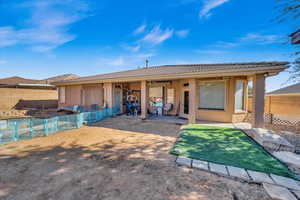 Rear view of property featuring a patio