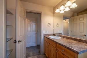 Bathroom with vanity and tile patterned flooring