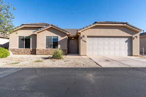 View of front of property with a garage