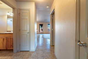 Hall with sink and light tile patterned floors