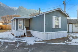 Manufactured / mobile home featuring cooling unit and a mountain view