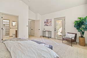 Master bedroom with lofted ceiling