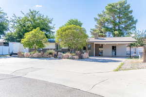 View of front of property featuring a carport