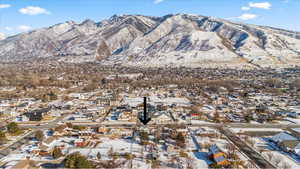 Snowy aerial view featuring view of Wasatch mountains to the East - sunrises from your front window would be incredible!