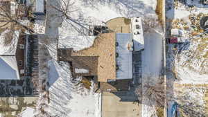 Snowy aerial view of roof in great shape and parking availability.