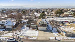 Snowy aerial view featuring view of Oquirrah mountains to the West.